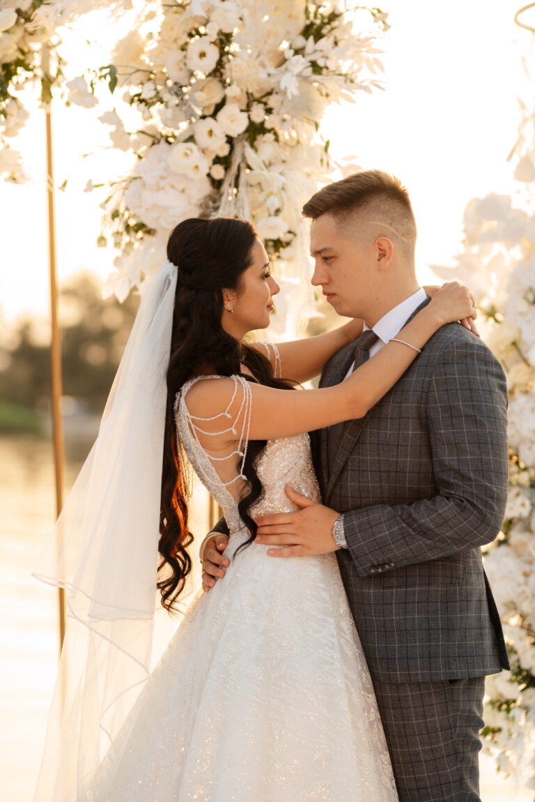 bride and groom against the backdrop of a yellow sunset
