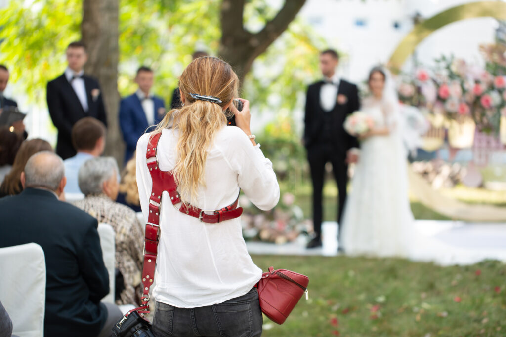 Wedding photographer takes pictures of the bride and groom